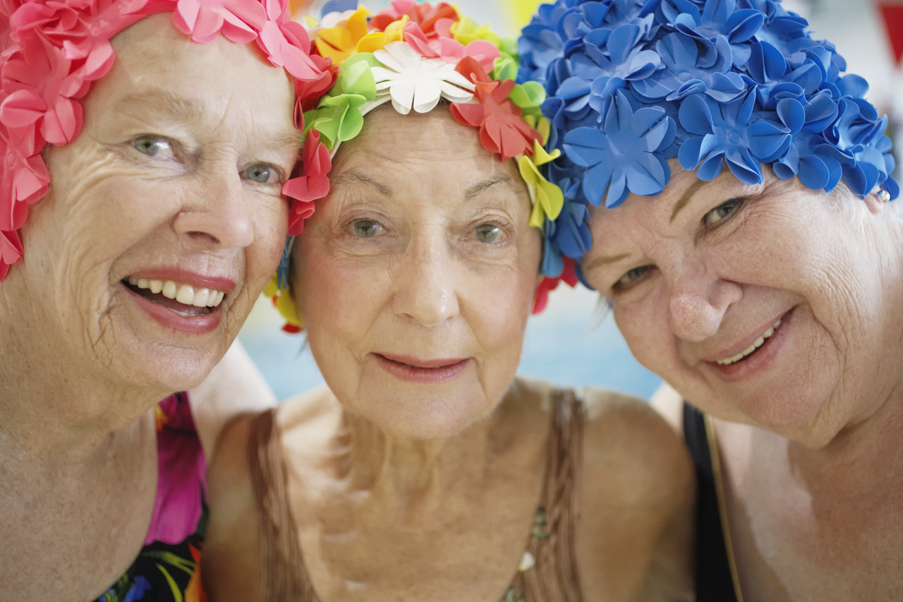 Women Wearing Colorful Bathing Caps --- Image by © Royalty-Free/Corbis