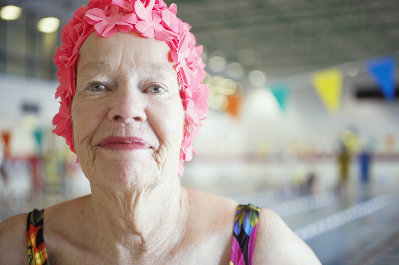 Woman in Colorful Bathing Cap --- Image by © Royalty-Free/Corbis